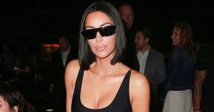 Kim Kardashian wearing sunglasses at night