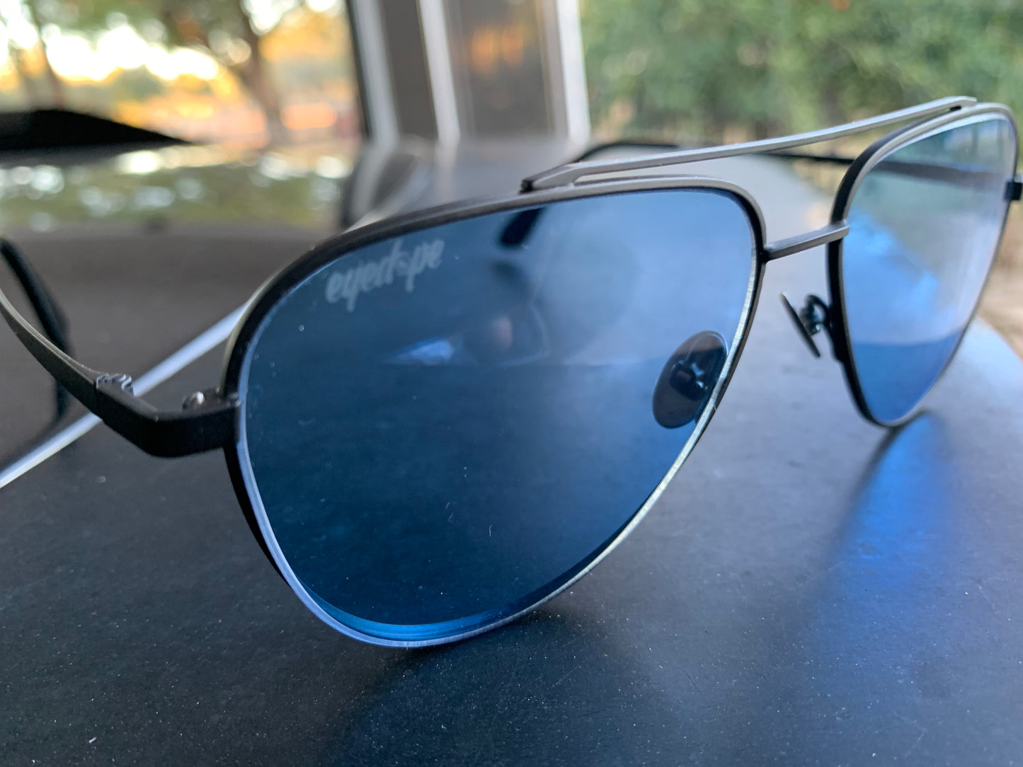 EyeDope aviator sunglasses with blue solid tint lenses.